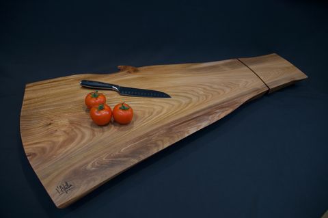 A custom slab chopping board in beautifully figured
        Scottish Elm