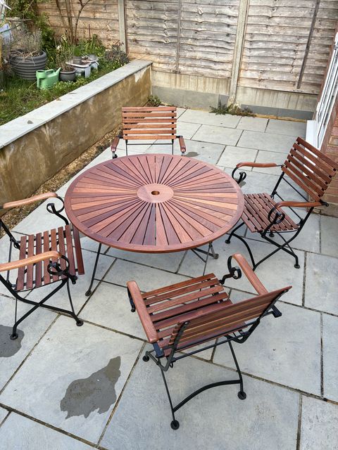 Sapele garden table and chairs rebuilt on their original
iron bases